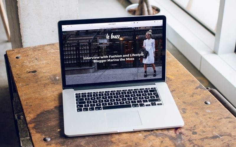 Website on a macbook creating an online presence for your record label