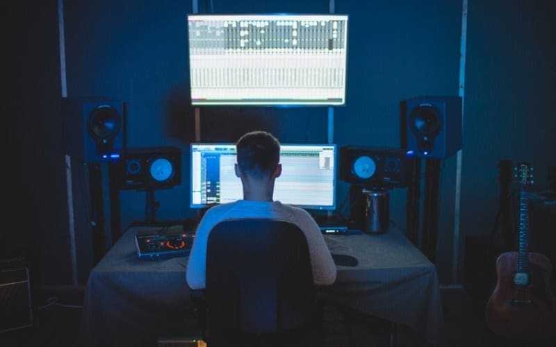 Music producer in the recording studio with monitors