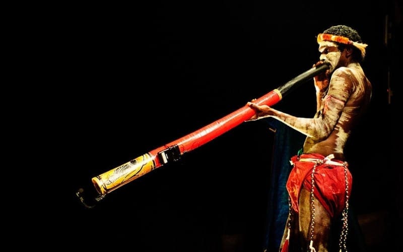 Australian Indigenous music, man playing didgeridoo Мusic Gateway