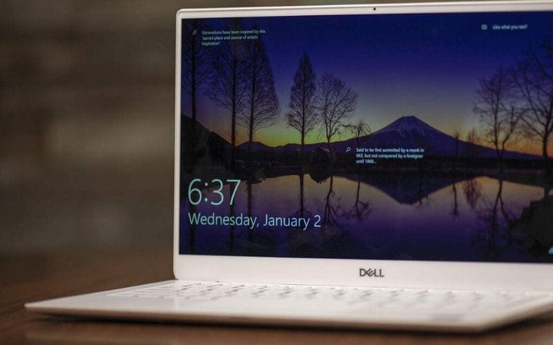A white Dell XPS 13 laptop with recording software