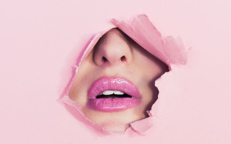 Woman in pink paper with pink lips
