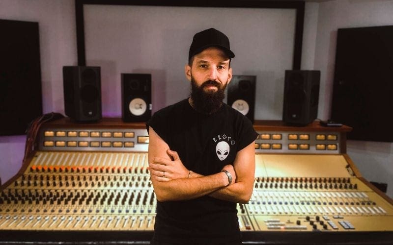 Drew bang in front of mixing desk at Strongroom studios London