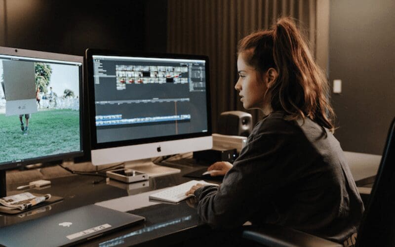 girl working on full time filmmaker computer editing