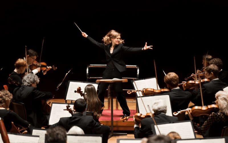 female Music Conductor passionately at work