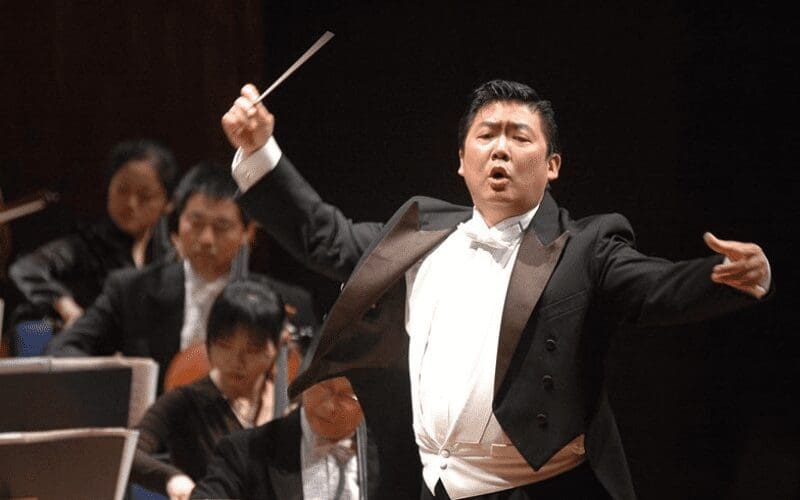 Music Conductor leading the orchestra