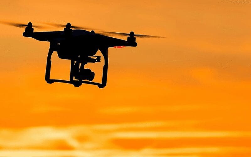 Drone film guide silhouette in golden hour