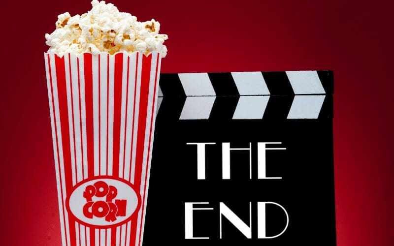 movie the end with clapboard and popcorn