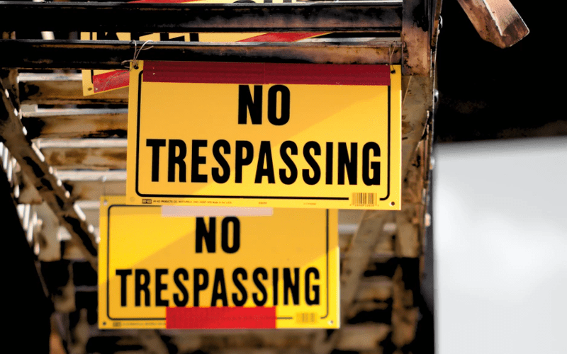 No trespassing signs hanging up.