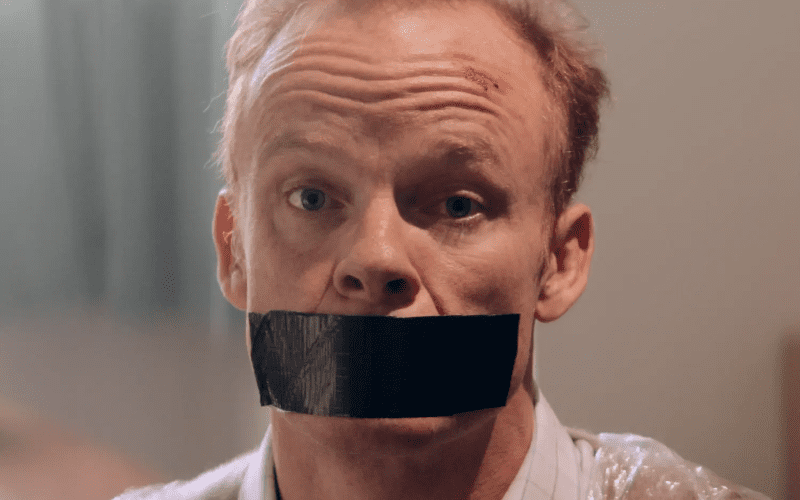 Man with tape over his mouth.