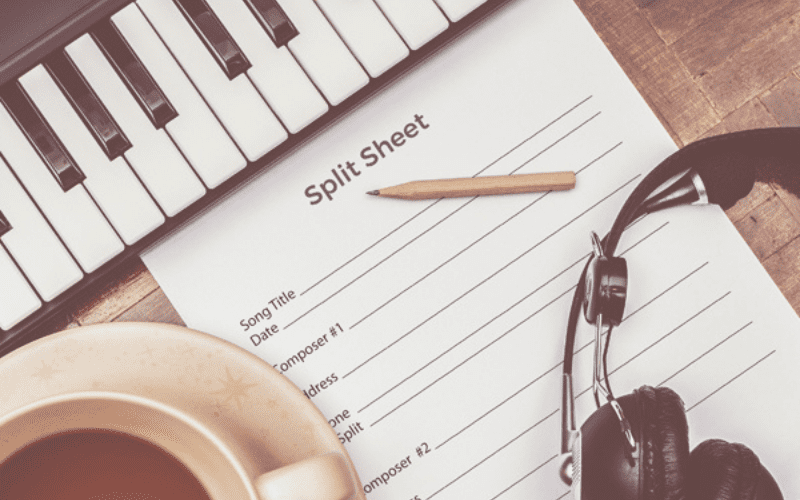 Split sheet on table with coffee headphones and piano
