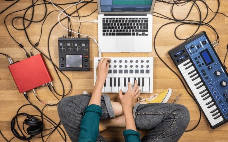 artist making music on computer