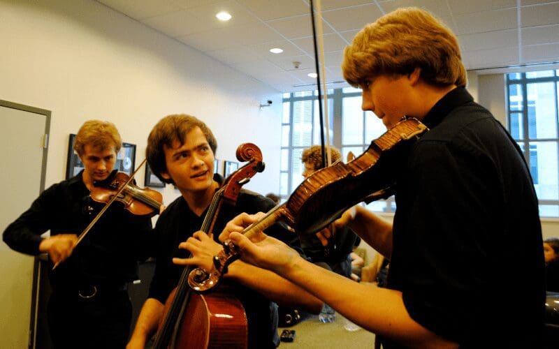 concert etiquette warm up behind stage classical musicians