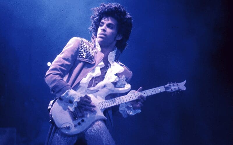 prince performing playing guitar
