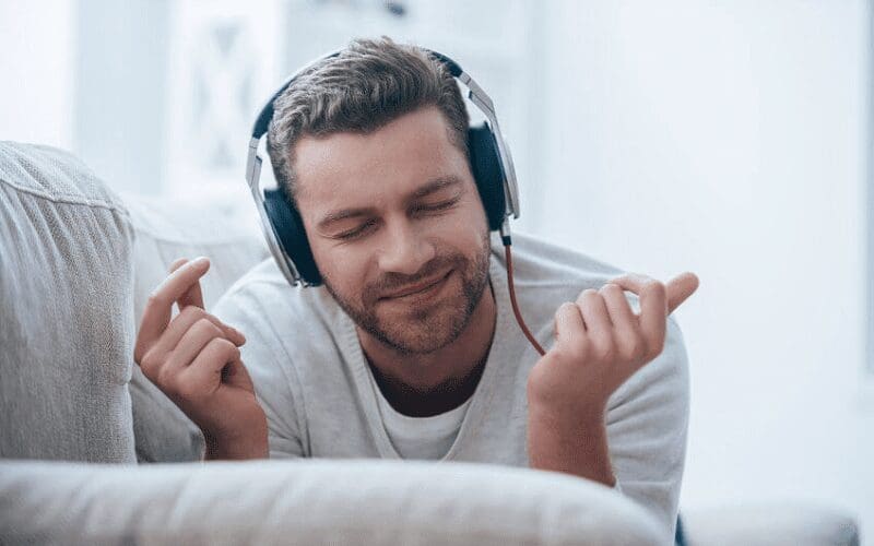 man listening to music happy how music affects your mood