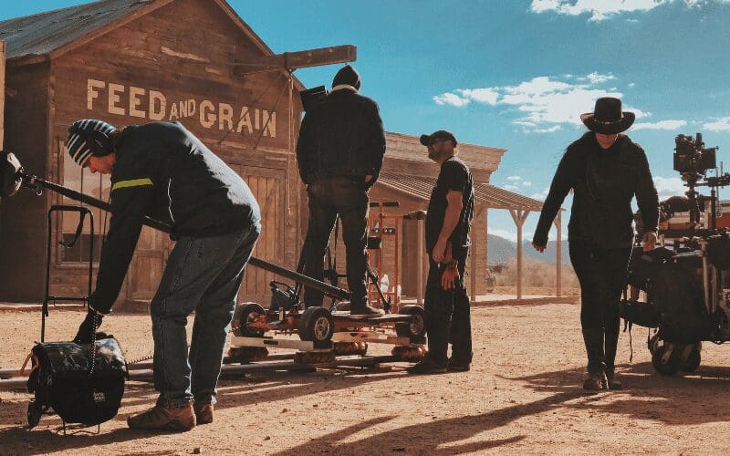 Prop masters on the set of a Western film