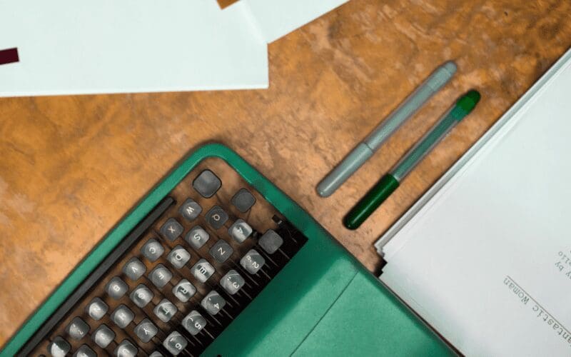 typewriter and pens stock photo