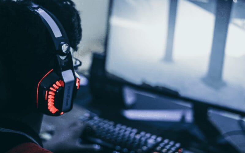 gamer with gaming headset on playing games