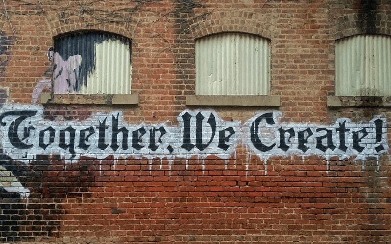 graffiti saying together we create 